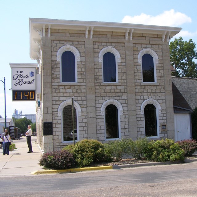 A stone, two-story brick building from the 1800s.