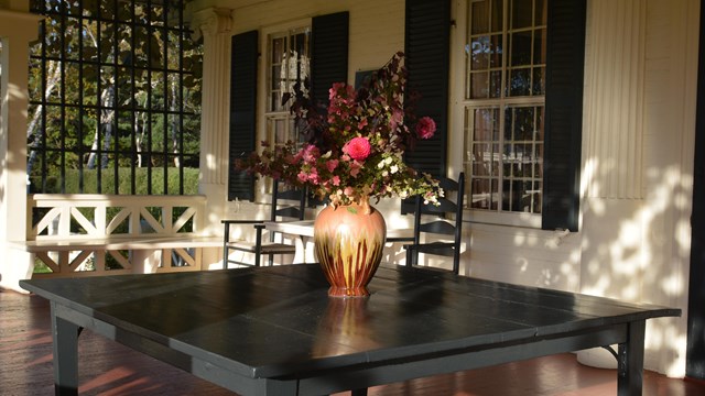 flowers in a vase on porch