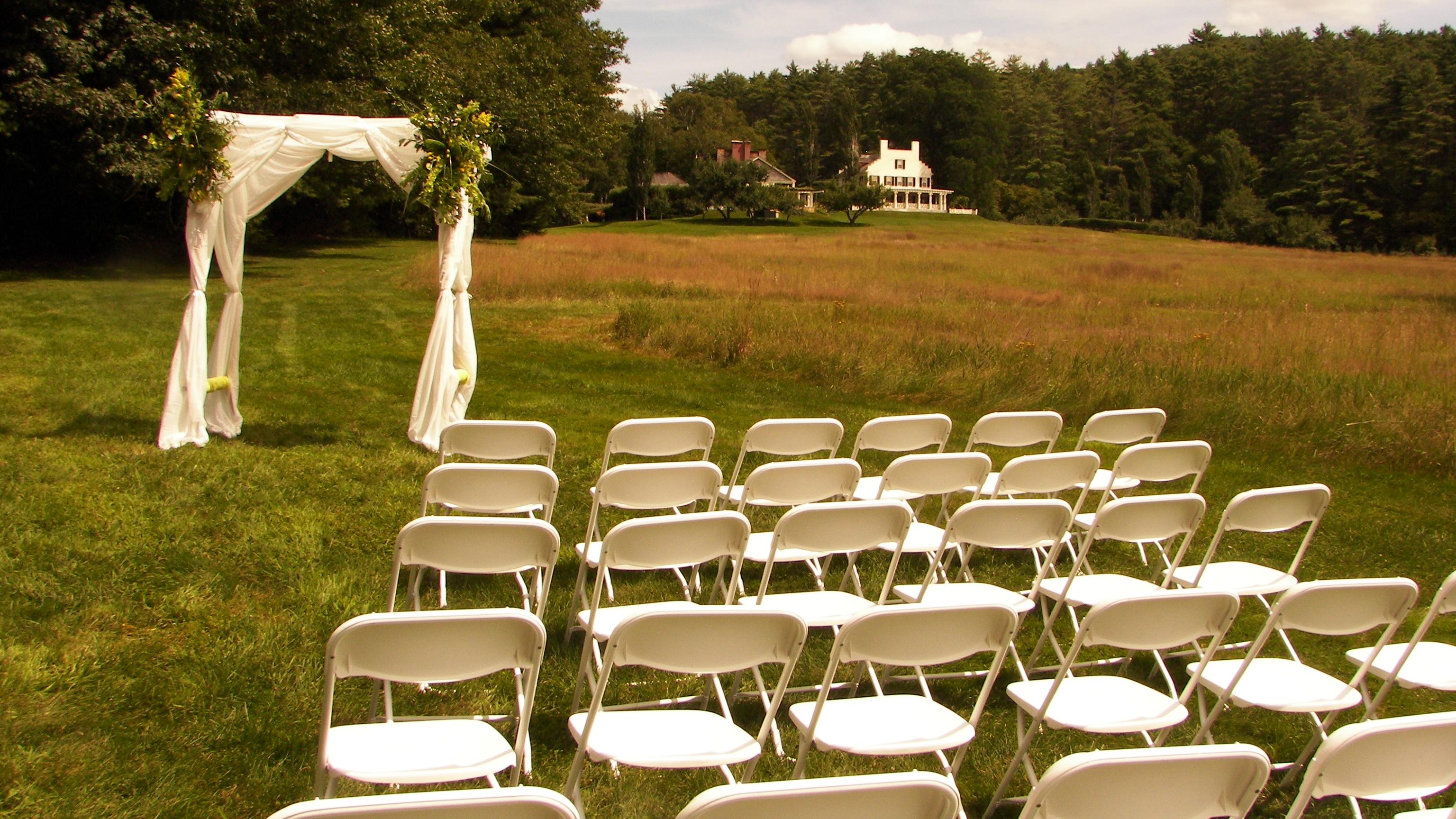 chairs and alter set up in field for a ceremony