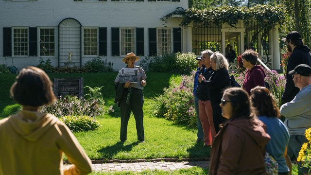 ranger speaks to group on flower garden