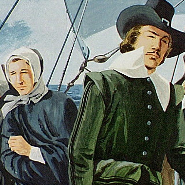 Two men in black hats and collared shirts with two women in black clothing and bonnets on a boat.