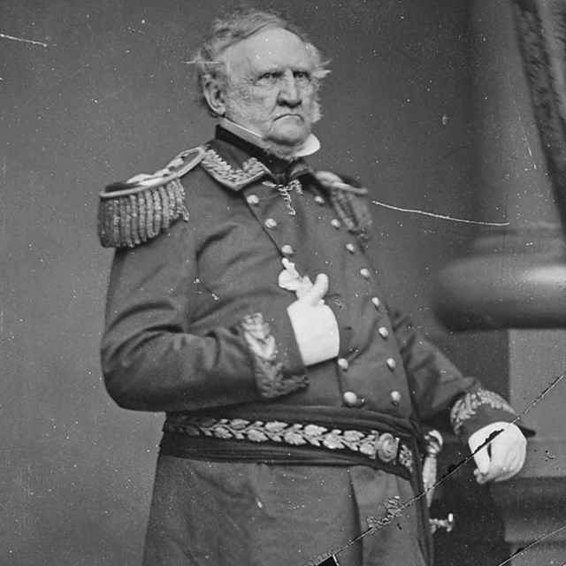Black and white photograph of a man in a military dress uniform