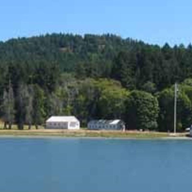 A waterfront area with buildings in the distance