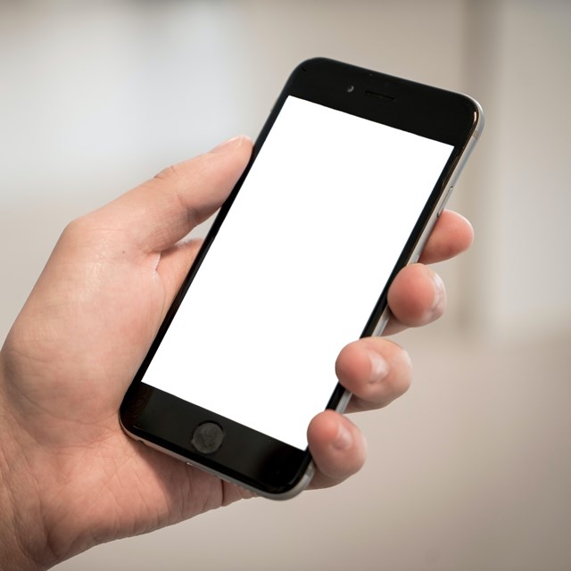 image of a hand holding a cellphone with a blank screen