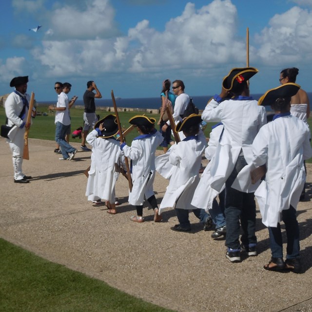 Young children dressed as Spanish soldiers