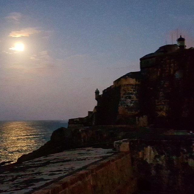 Moon reflecting in the Atlantic, with El Morro Fortification in the foreground