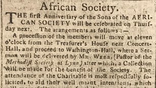 A yellowed newspaper article with the words African Society at the top.