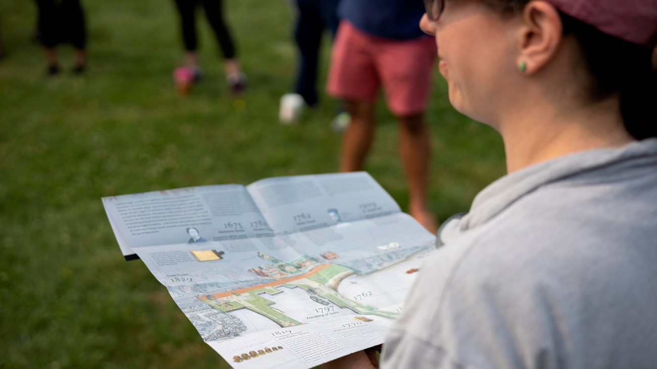 A person holds a map of Salem Maritime.