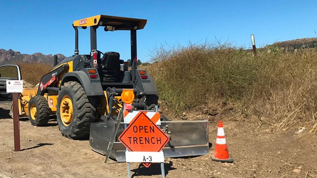 construction excavator sitting on a dirt lot