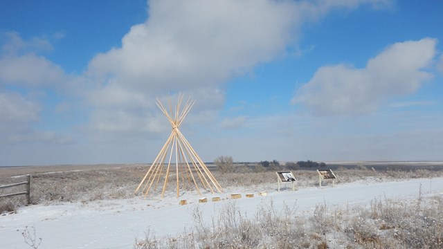 A tipi frame atop Monument Hill