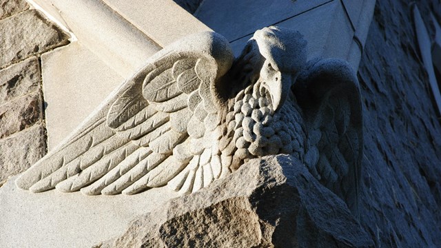 Detail of eagle carved into stone