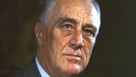 A portrait of FDR looking stoic