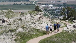 A group of hikers heads out to an overlook on one of the Summit trails.