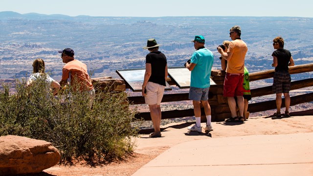 Visitors look out over the Grand Canyon.