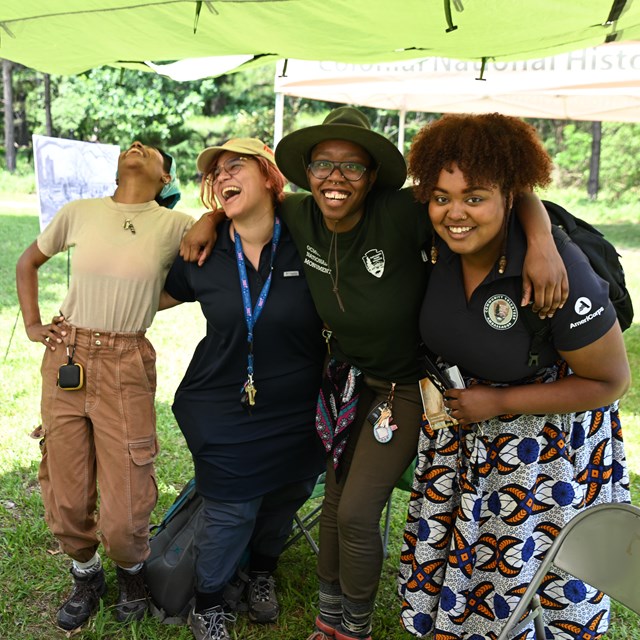 Interns and NPS staff smile at you.