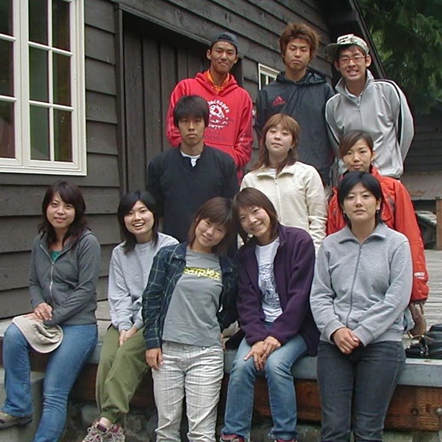 A group of Japanese volunteers pose.
