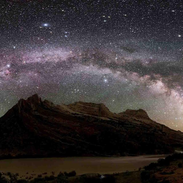 The Milky Way shines bright in the park dark sky.