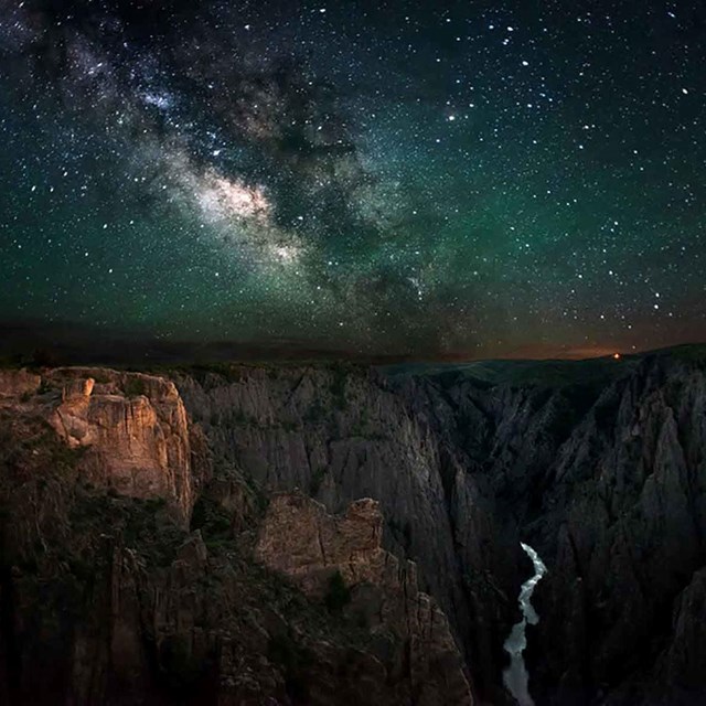 A dark sky with bright Milky Way over the Black Canyon of the Gunnison.