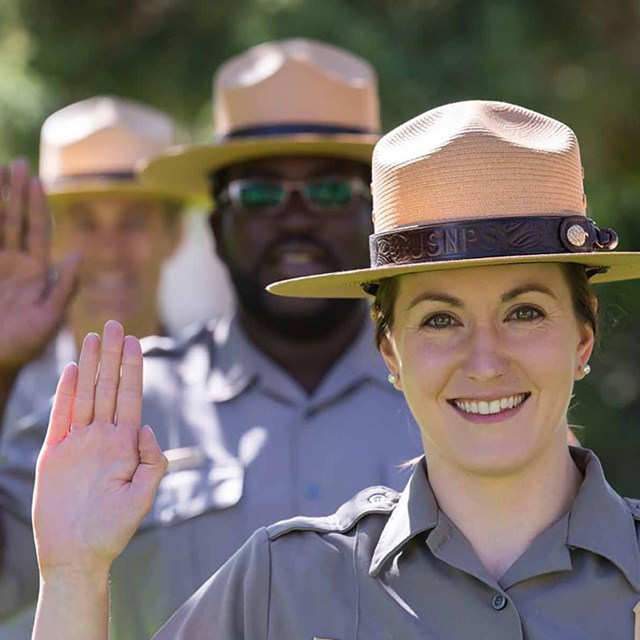 Park Rangers lined up taking an oath.