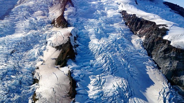 A closeup of a glacier with medial moraines.