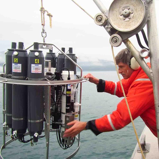 A researcher prepared equipment to sample ocean water.