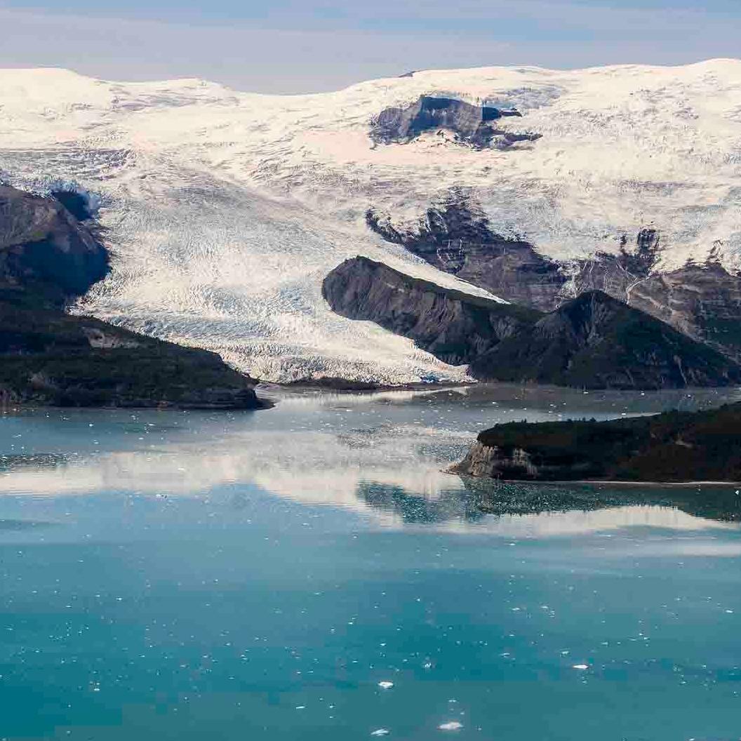 Icy Bay with a tidewater glacier meeting blue water.