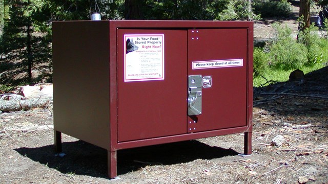 A metal food storage box is provided at each campsite.