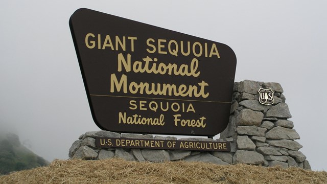 An entrance sign for Giant Sequoia National Monument. 