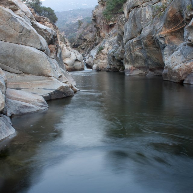 A river flows through a steep rocky canyon. Photo by Naoko Otani.