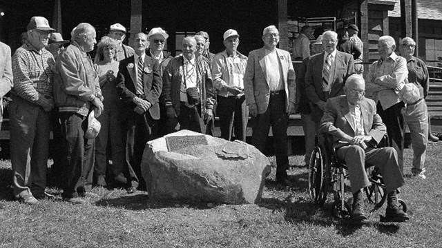 A black and white photograph of a group of men standing for a picture.