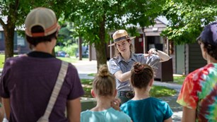 A Park Ranger in talks to a group of visitors in the foreground.