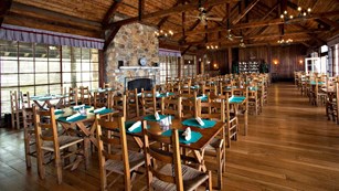 High ceilings, large windows and rustic furniture at the Spottswood Dining Room at Big Meadows.
