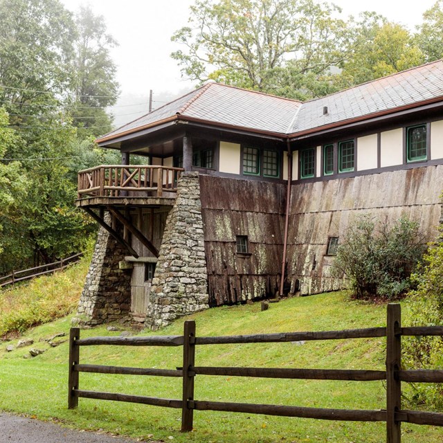 A rustic cabin on the side of a hill.