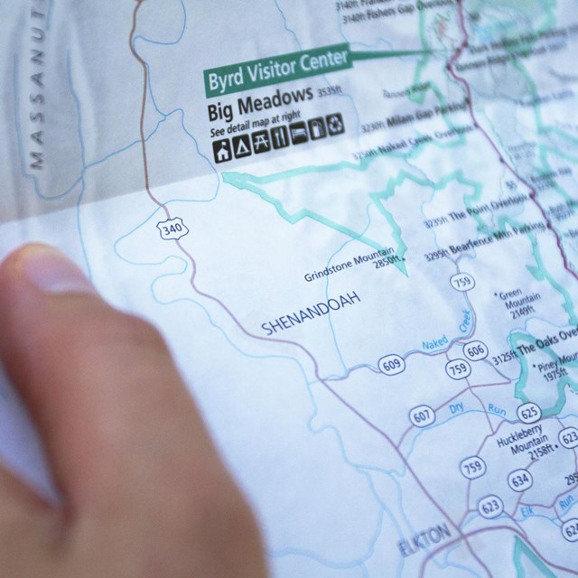 A close-up of a hand holding a map of Shenandoah.