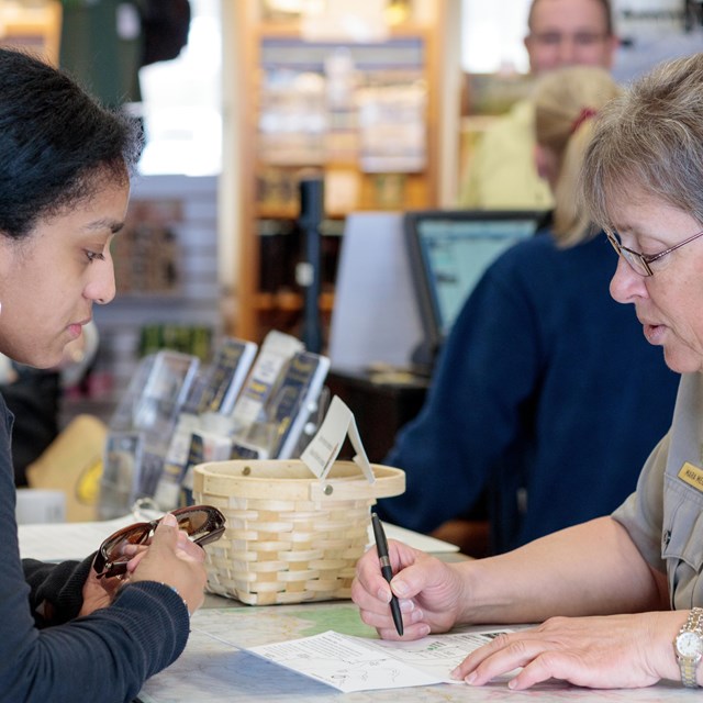 Ranger assisting guest in Visitor Center