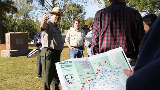 A park ranger leads a tour