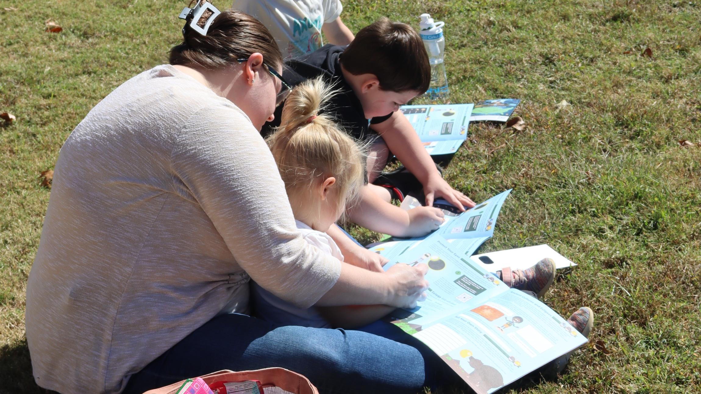 Mom and children completing the Junior Ranger Books
