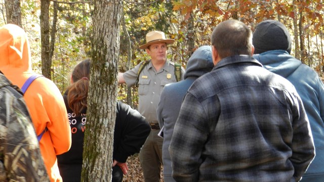 A park ranger leading a hike. 