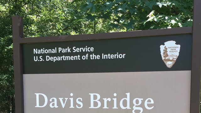 Brown and white Davis Bridge Battlefield sign