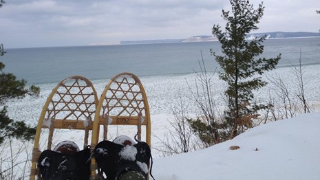 Looking out at Platte Bay through a pair of snowshoes