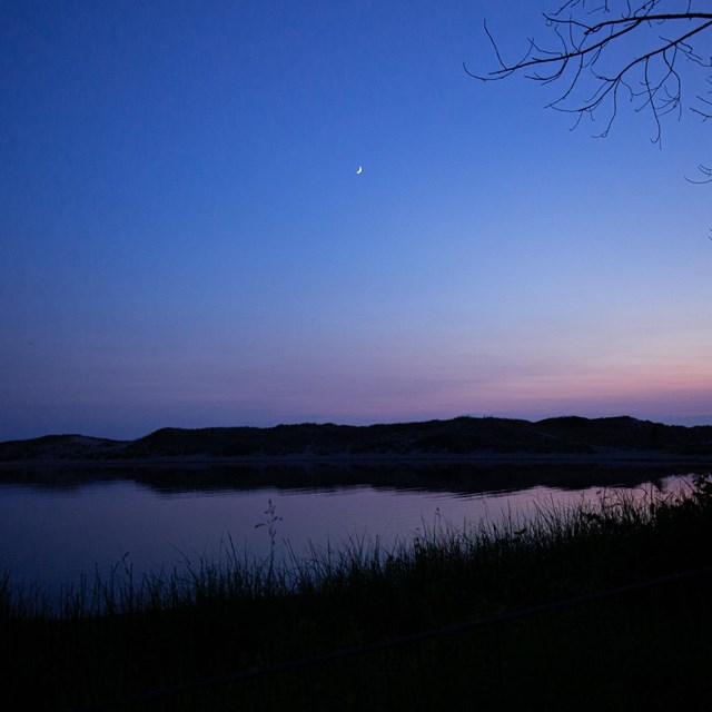 A blue and purple sunset over a body of water