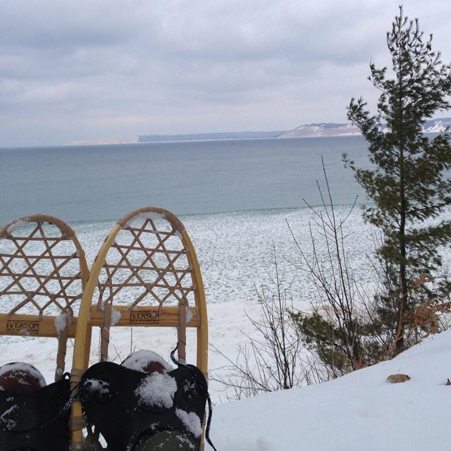 Looking out at Platte Bay through a pair of snowshoes