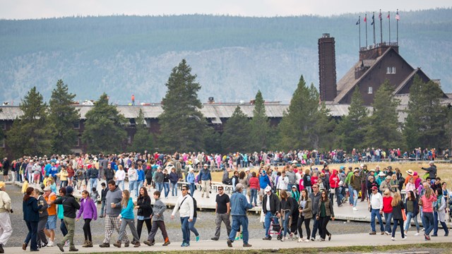 visitors at Yellowstone National Park NPS Photo/Neal Herbert