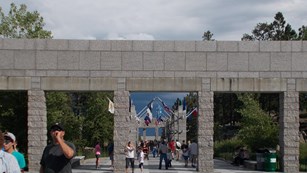Visitors move through the promenande at Mount Rushmore National Park.