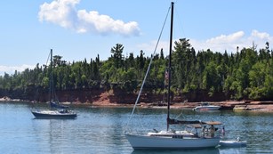 A sailboat anchors at Apostle Island National Seashore