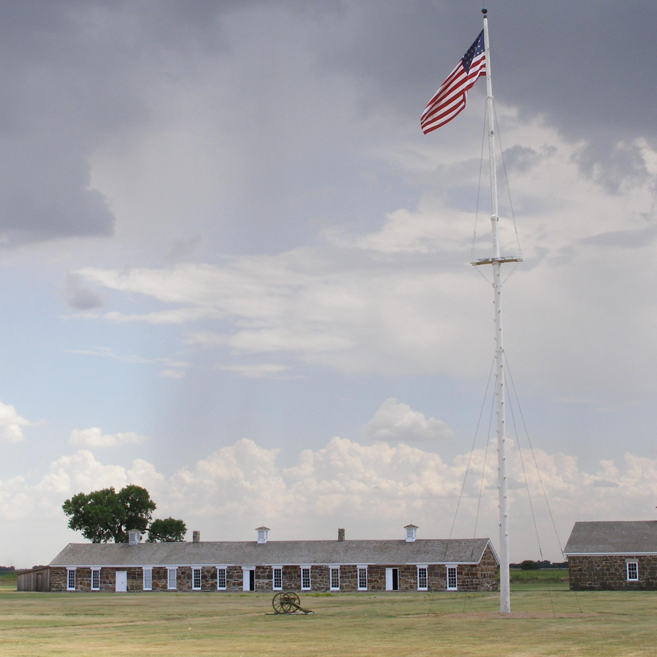 Long, low building surrounded by grasslands
