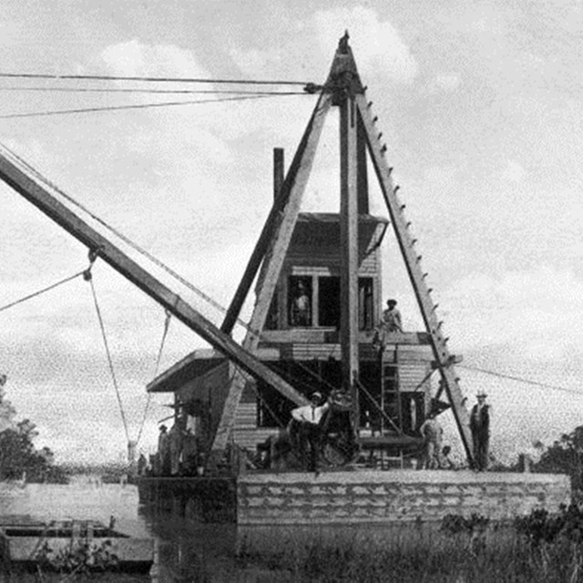 A bucket dredger photographed in the 1910s