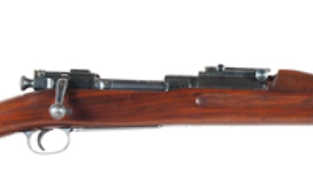 A color photo of a M1903 Rifle with bayonet. 