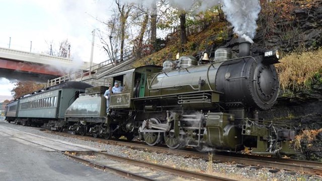 Steam Locomotive Pulling Passenger Cars