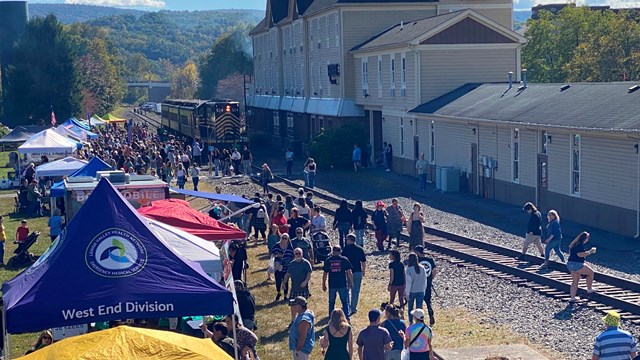 Train Platform with Diesel Engine, festival tents and adjacent station buildings